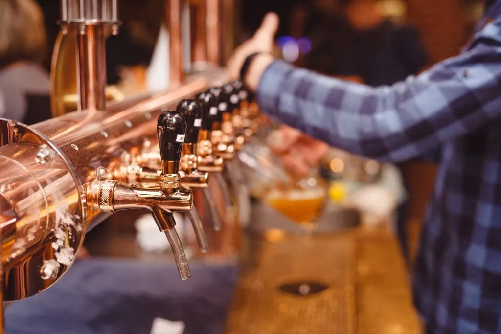 A Lot Of Beer Taps In A Close up Bar