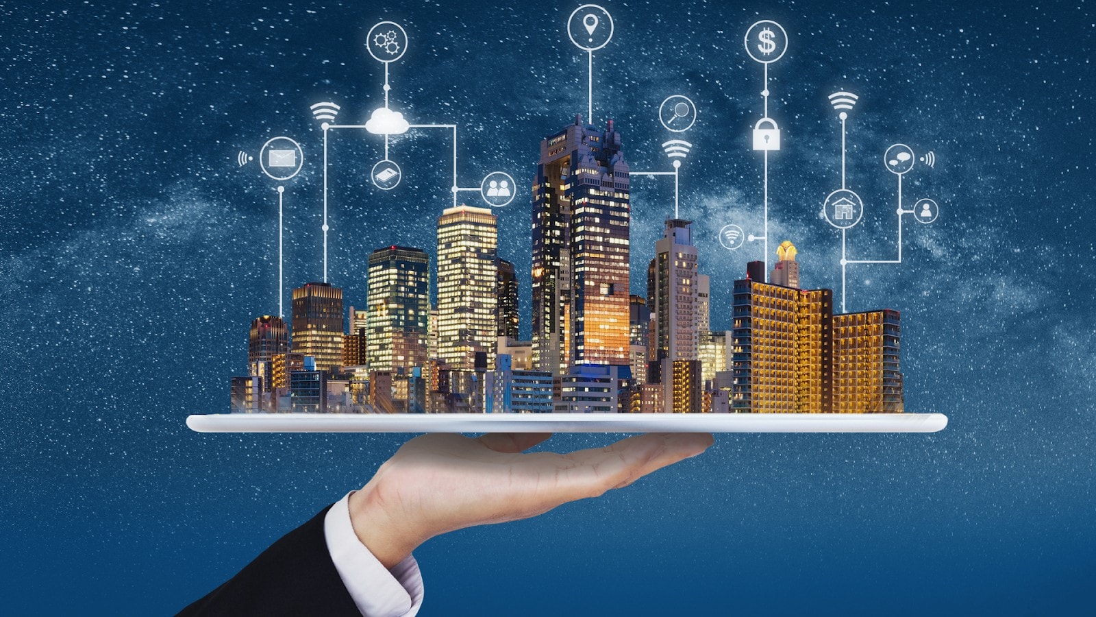 A hand holding up a smart city on a silver platter